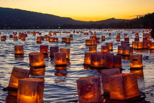 Lanterns on a lake at sunset
