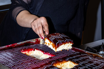 Chef prepares trilece dessert in the kitchen. Turkish Traditional Trilece - Tres Leches Dairy...