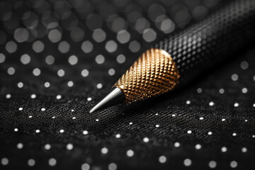 Luxury black and gold mechanical pencil. Close-up of pencil tip on black background. - Powered by Adobe