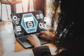 API, Application Programming Interface concept, Businesswoman using laptop computer on desk with API icon on virtual screen, Software development tool, information technology, modern technology.