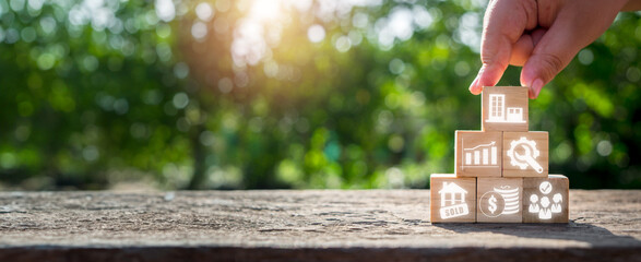 Property management concept, Hand holding wooden block on desk with Property management icon on...