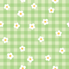 Cute fashion seamless pattern in style of picnic. Scottish tartan Vichy plaid with ditsy flowers, print for fabric, wrapping paper, package, banner, card. Classic textile print vector background.
