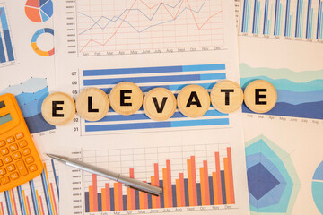 wooden blocks displaying the word 'ELEVATE' signify a concept of progress