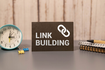 LINK BUILDING text on a notebook on green paper