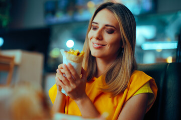 Restaurant Customer Eating a Shawarma Wrap and Smiling. Cheerful girl eating good vegetarian fast...