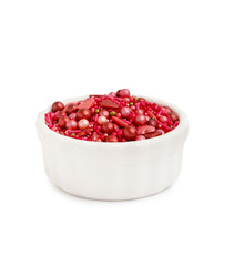 Bowl with sweet pink sprinkles on white background