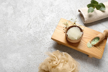 Composition with body scrub and bath supplies on grunge background