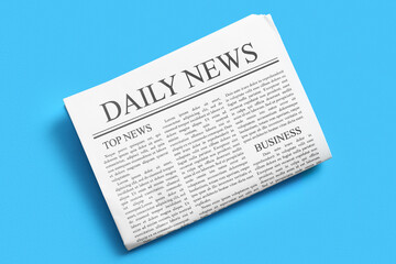 Daily newspaper on blue background
