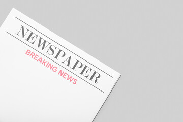 Blank newspaper on grey background