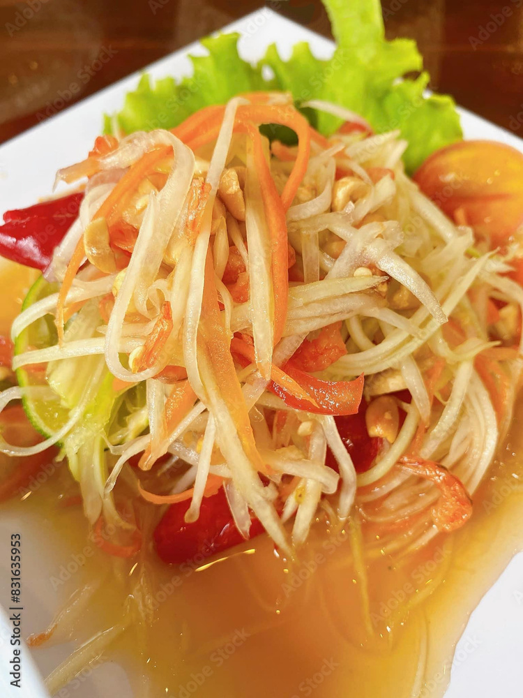 Wall mural thai papaya salad with spicy sauce.