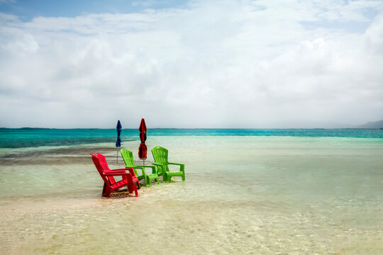 Colorful lawn Chairs and Umbrellas at Morrocoy Beach Venezuela