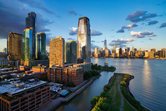New York and Jersey City illuminated by the light of the setting sun.