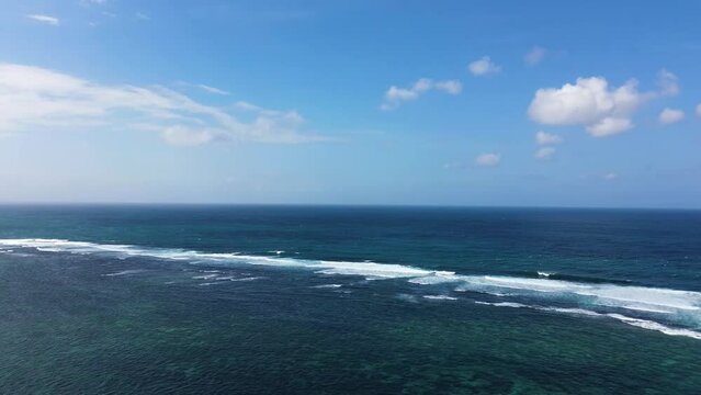 Aerial view of ocean waves in Tanah Barak beach, Bali, Indonesia