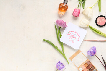 Greeting card with text HAPPY MOTHER'S DAY, beautiful tulips, makeup cosmetic products and bottle of perfume on white background