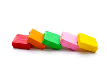 Colorful plasticine clay on white background.