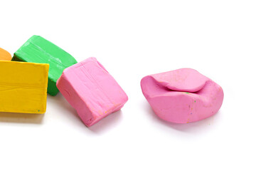 Colorful plasticine clay on white background.
