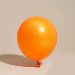 Isolated Orange Balloon Against Plain Background
