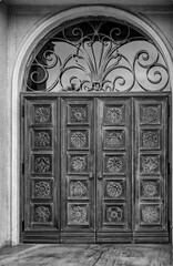 French Doors with a Glass and Metal Transom Above in Black and White.