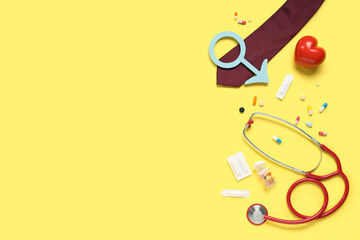 Stethoscope, tie, heart, pills and male sign on yellow background. Prostate cancer awareness