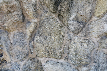 The mansion uses beachrock for its walls / fence. Beachrock is sedimentary rock that consists of a variable mixture of gravel, sand, and silt-sized sediment. fragments of coral and shells .
