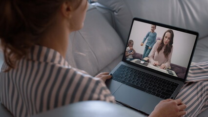 Home girl talking online using laptop closeup. Happy two sisters videocalling