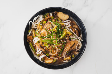 asian inspired rice noodle soup with green beans eggplant and water chestnuts