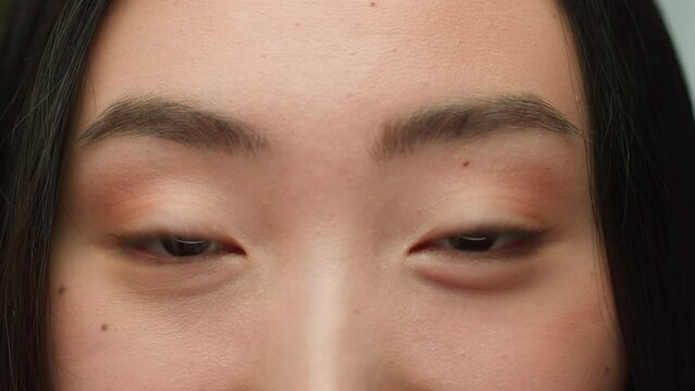Close up dark eyes gaze Asian woman looking at camera human iris eyeball chinese korean girl open eyelid lashes good eyesight vision problem laser eye surgery female beauty model cropped face details