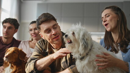 People dogs resting home together close up. Happy group friends caressing pets