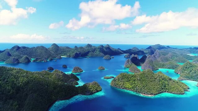 Aerial shot a Limestone islands form a remote lagoon in northern Wayag, Raja Ampat, Indonesia.
