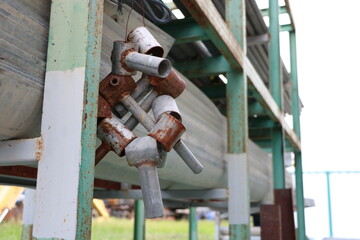 Close-up photo of Old scrap metal is hung on a shelf.