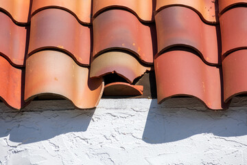 Damaged broken clay roof tile. Close up. © MichaelVi