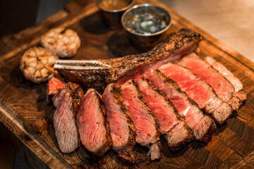 Beef steaks on the grill with flames