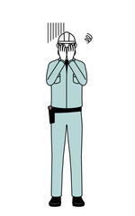 Man in helmet and workwear covering his face in depression.