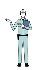 Man in helmet and workwear with sunglasses and holding a rifle.