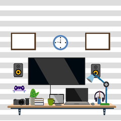 A work room with a tablet computer, headphones, monitor and other equipment fully equipped for work.
