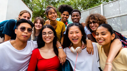 Group of happy and smiling multiracial university students looking at camera. High school students.
