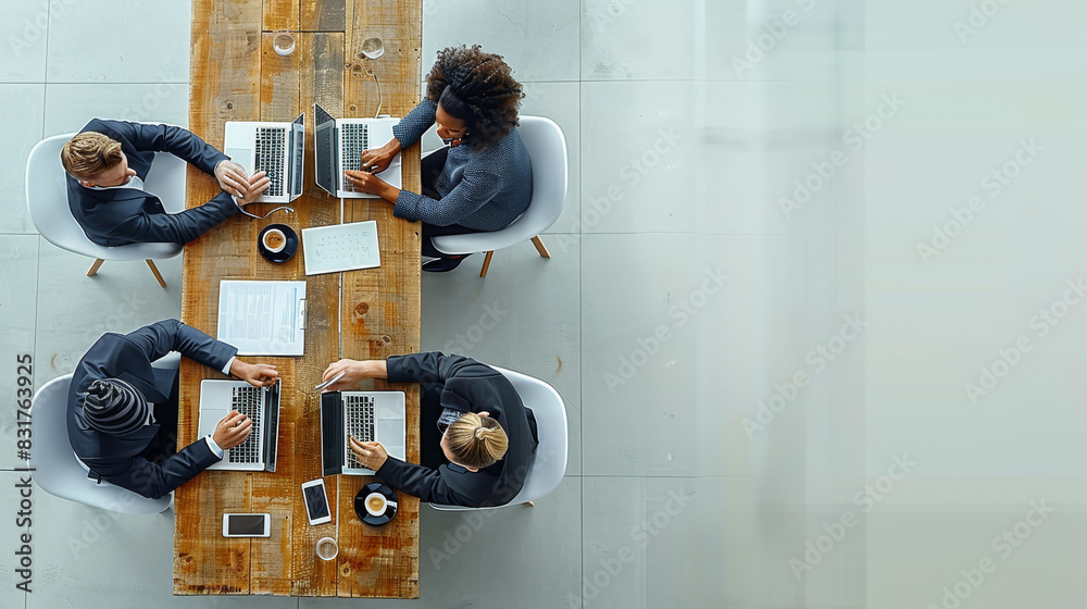 Aufkleber a professional business meeting setting with people in formal attire, laptops, and documents on a wh