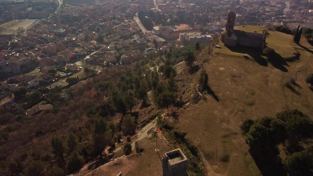 Hermitage of sant cugat de gavadons overlooking tona town in barcelona, aerial view