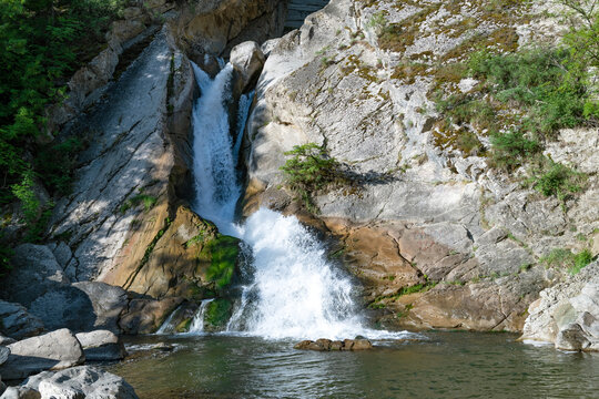 Khanag (Khuchni) waterfall on a sunny May morning. Neighborhoods of Khuchni. Republic of Dagestan, Russia