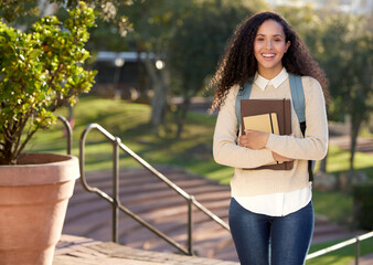 Portrait, student and woman with book, campus and university for lecture with notebook. Smile, studying and education for female person in school, college and backpack in nature for travel to class