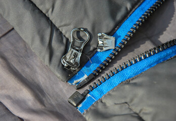 broken zipper close-up. selective focus © Dmytro