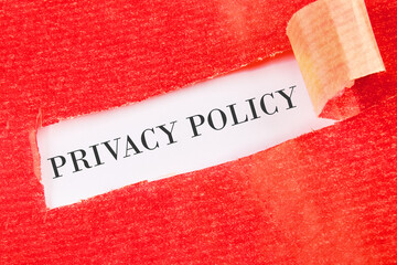 Concept Privacy Policy text written under the torn paper on a white background