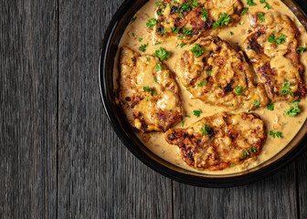 creamy smothered pork chops cooked in onion gravy