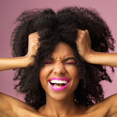 Girl, smile and hair care in studio with confidence for afro, hairstyle and trendy black person....