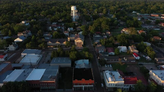 Natchez, Mississippi, USA - April 21, 2024: Sunset bathes historic downtown Natchez in beautiful golden light.