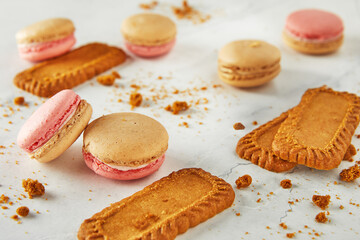 A spread of macarons and lotus cookies, delicious finger food on the table