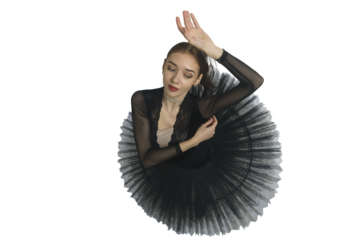 portrait of a young ballerina in a black tutu dancing with her hands moving top view, immersion in dance, isolated on transparent background, png