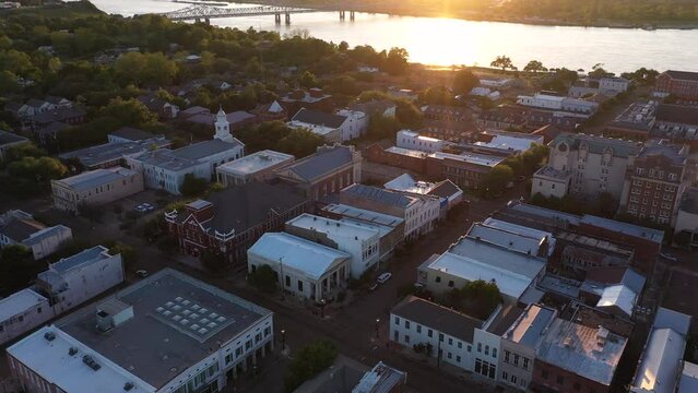 Natchez, Mississippi, USA - April 21, 2024: Sunset bathes historic downtown Natchez in beautiful golden light.