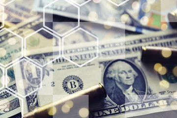 Live ammunition with bullets,  bills, close-up, selective focusing. Concept: sale of weapons under...