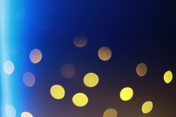 Abstract bokeh background. Golden bokeh circles on dark blue background. Layer overlay.